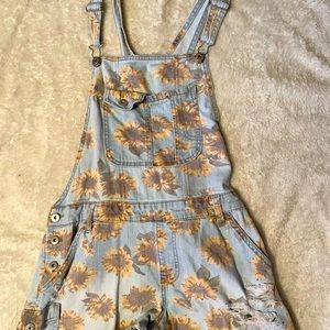 Selling sunflower overalls in a size medium